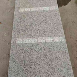 青岛芝麻白光面毛板